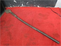 Long antique wrench tool.