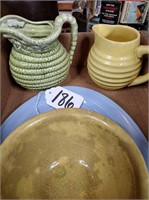 Flat of pottery pitchers, bowls, & plate