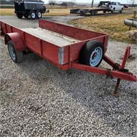 Red Trailer with Ramps and Spare Tire.