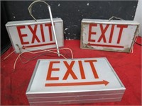 Three Lighted Exit signs.