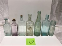 Seven Vintage Bottles