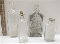 4 medicine and liquor clear glass bottles
