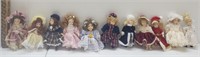 A collection of 11 cute mini porcelain dolls