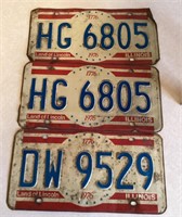 Three 1976 license plates