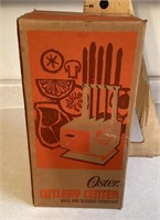 Vintage Oster Cutlery center in box