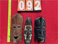 3 carved wood masks