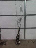 SEVERAL MISC FISHING POLES AND REELS