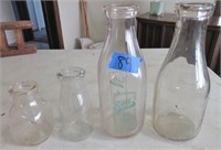 4 milk bottles, one being Bell Dairy Norwalk
