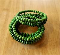 lot of green beaded bracelets