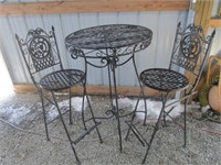 Folding wrought iron table and stools
