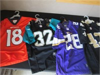 four NFL Youth jerseys