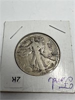 Silver half dollar stamped ford