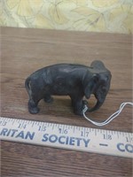 Cast iron arcade elephant tucked trunk Bank