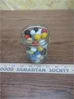 Jar of marbles of multiple sizes
