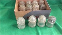 Box of clear vintage insulators