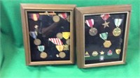 Two glass cases of medals