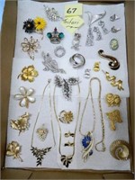 Flat of Trifari Necklaces, Earring, Brooches