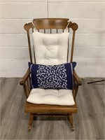 Rocking chair with white cushions