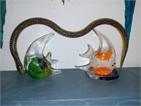 Two art glass fish and a wooden snake