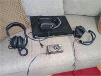 Two headphones DVD player and a camera
