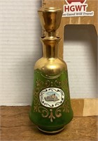 Gold-trimmed green glass decanter