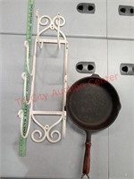 Cast-iron pan and metal shelf