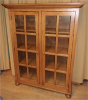 Oak curio cabinet.