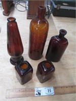 Five Vintage Brown Glass Bottles
