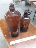 Two Large Brown Glass Bottles