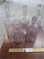 Group of Old Purple Glass Bottles