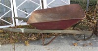 Antique wheel barrow steel and wood construction