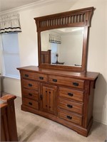 Dresser with mirror. The dimensions are 66 inches