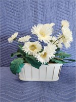 White wooden woven basket with faux flowers