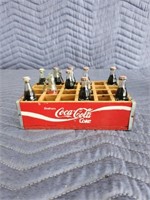 Coca-Cola mini bottles and wooden crate
