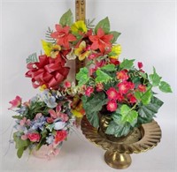 Faux floral arrangements, brass planters