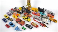 Assorted toy cars and trucks
