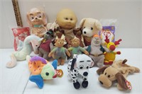 A collection of stuffies, beanie babies, & doll