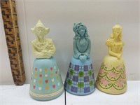 A collection of three girl Avon decanters