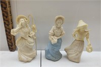 A collection of three girl Avon decanters