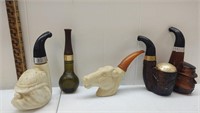 A collection of five pipe Avon decanters