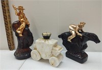 A collection of three Western themed Avon decanter