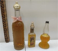 A collection of three beautiful Avon bottles