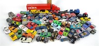 Assorted toy cars, including Meijer truck and
