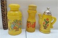 A collection of three pretty Avon decanters