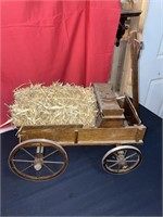 Small wooden wagon and straw