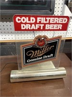 Miller, genuine, draft beer light works. Hold