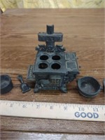 Miniature cast iron princess stove with pots and