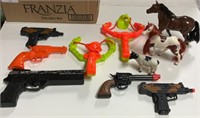5 plastic toy guns, 3 plastic toy horses &