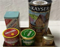 5 empty tin canisters, pipe tobacco, Parmesan