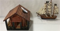 Small wooden log cabin & small wooden pirate ship